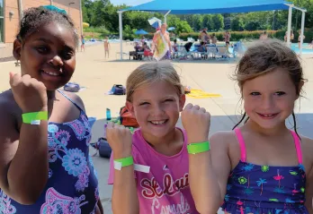 YMCA Go for Green Program Participants Safety Around Water Initiative with Green Swim Bands