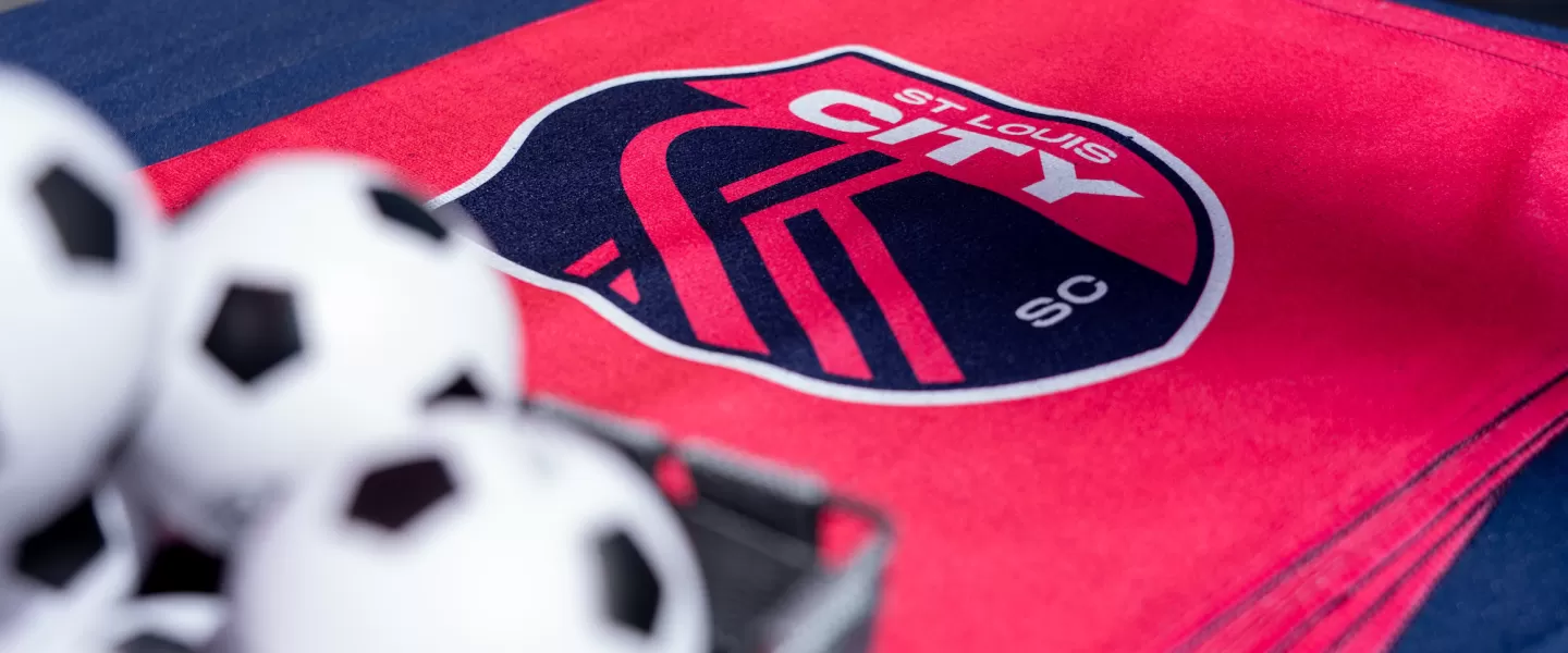 A close-up of the free CITY SC towels with the team's logo, neatly stacked and given out as swag at the kickoff event.