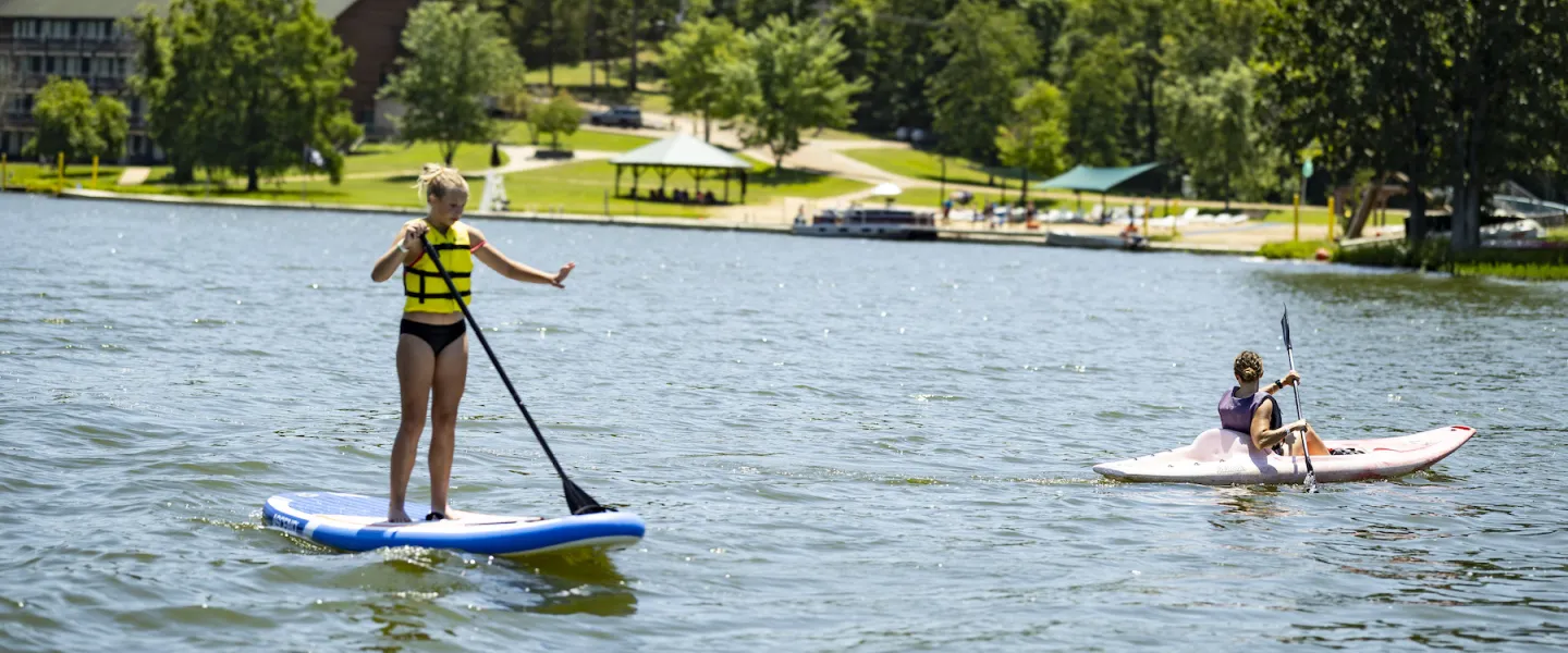Girls paddle-boarding and kayaking on Sunnen Lake at YMCA Trout Lodge in Potosi, MO 