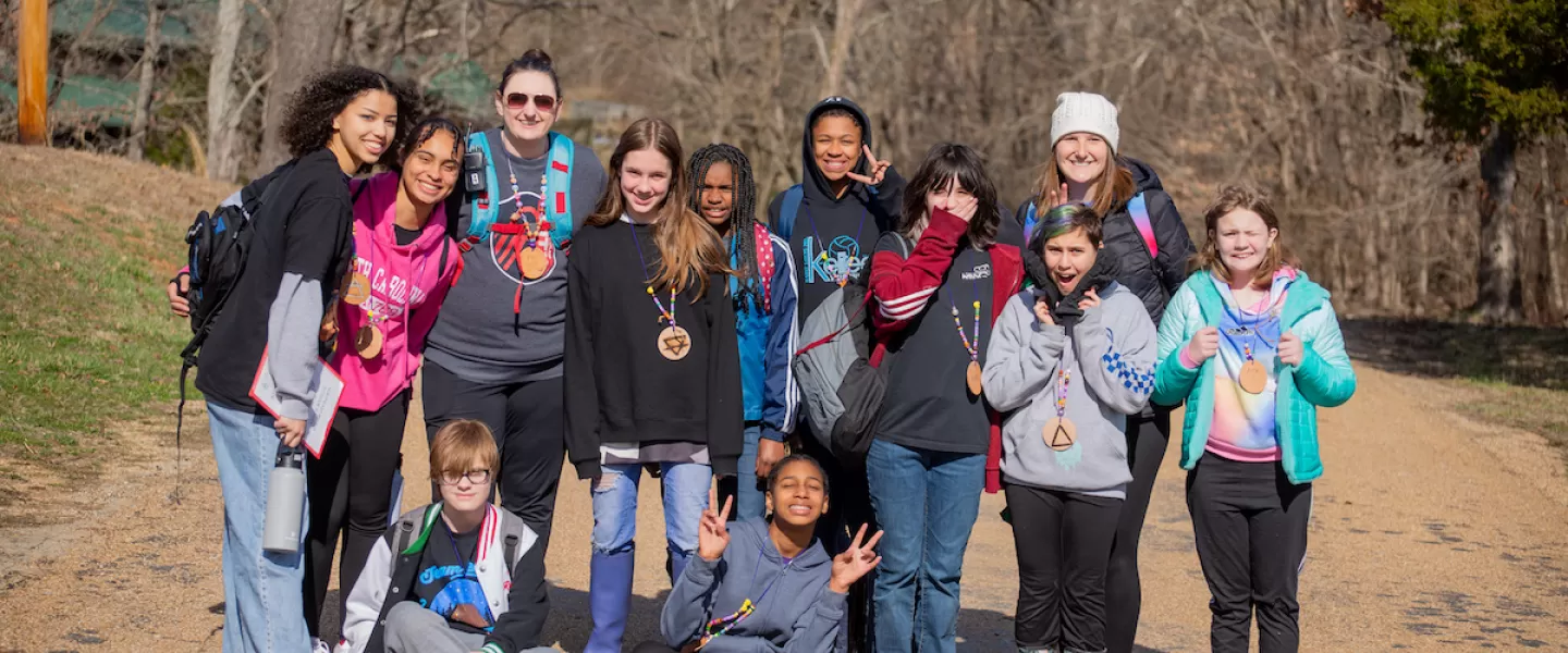 Teacher and students gather for a group photo on the camp lakewood campus