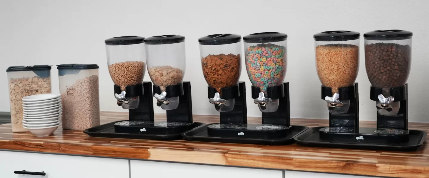 Cereal bar with assorted breakfast cereals and milk for guests of all ages