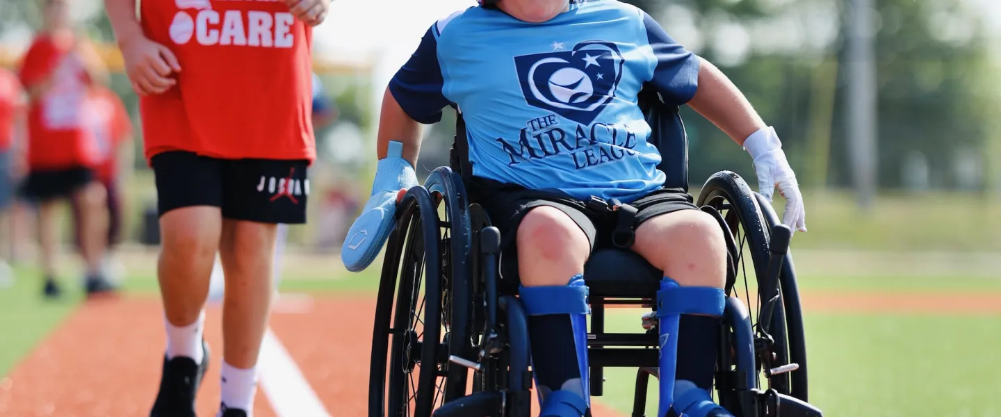 A young athlete crosses home base scoring a run at the the South County YMCA's Adaptive Sports Complex