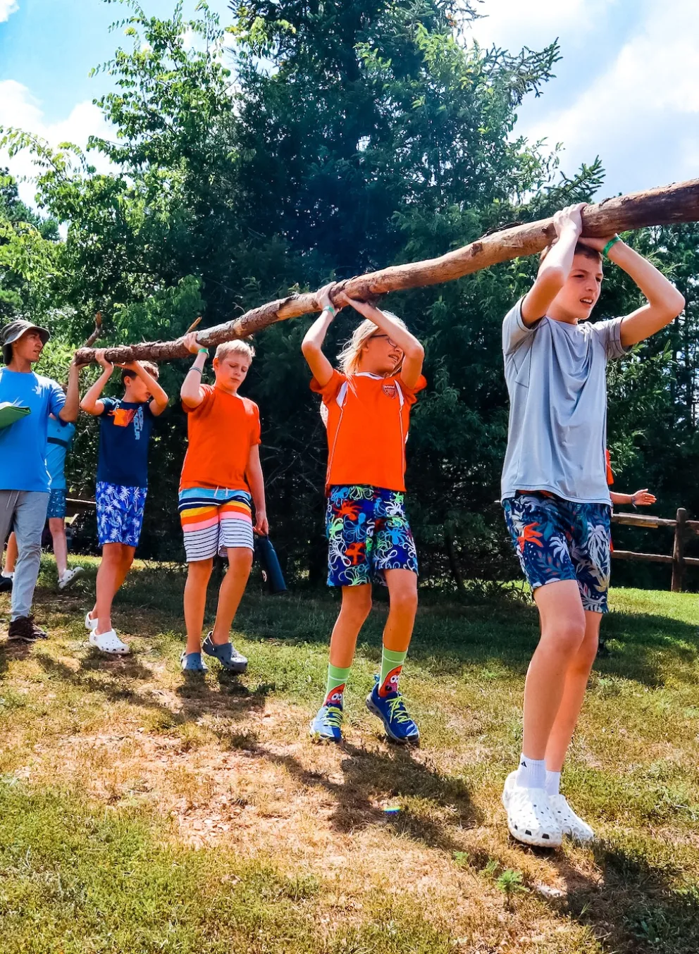 ymca camp lakewood 2025 campers carrying log