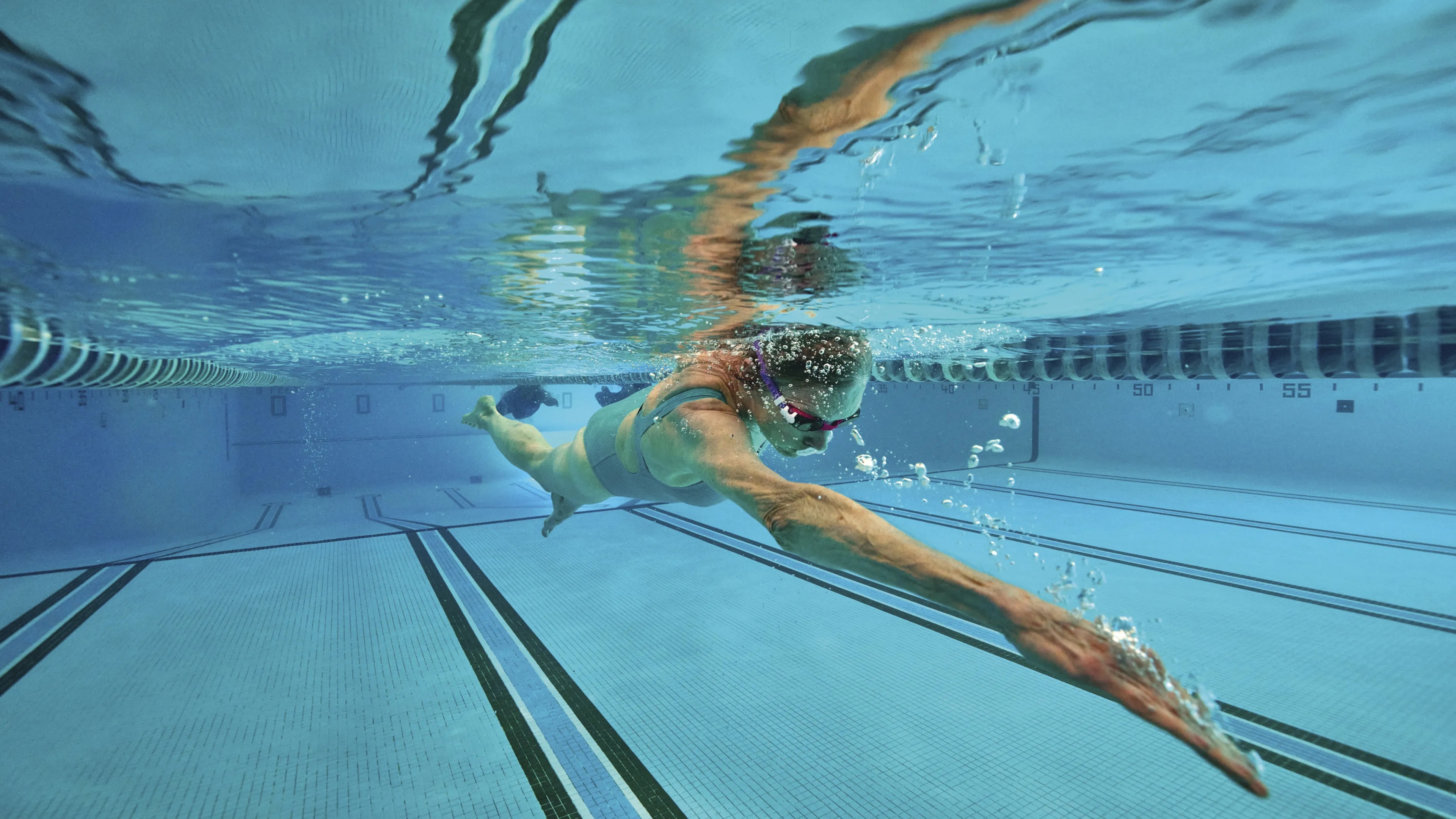 adult swimming at a ymca pool