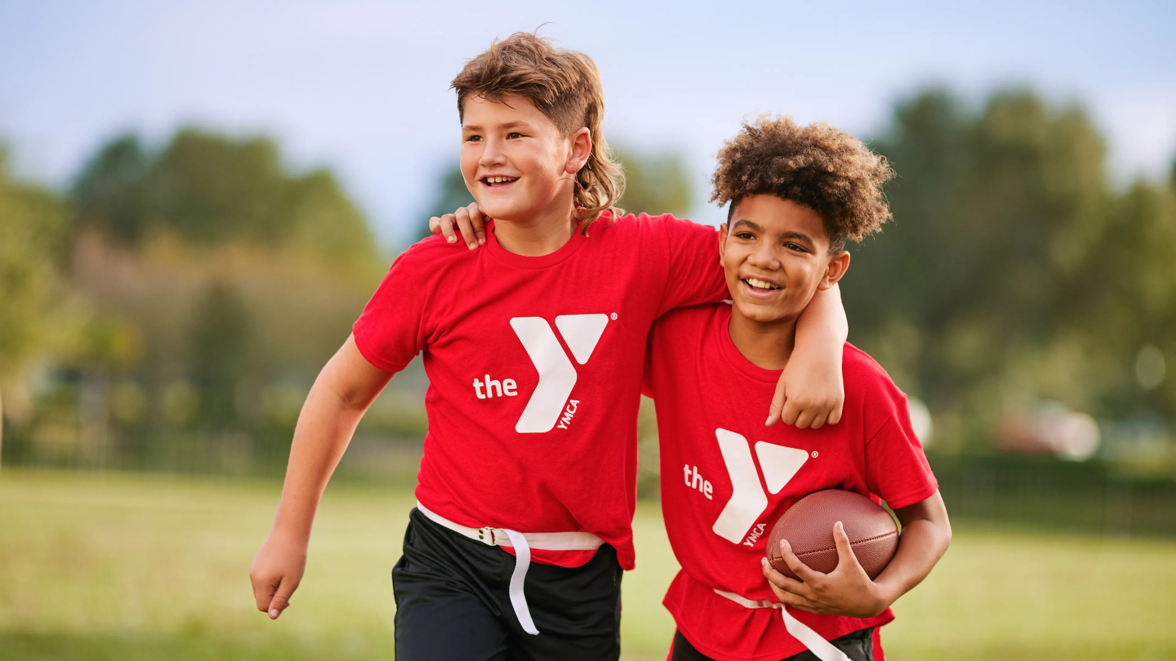 YMCA Youth Flag Football League Friends and Players Smiling at Practice