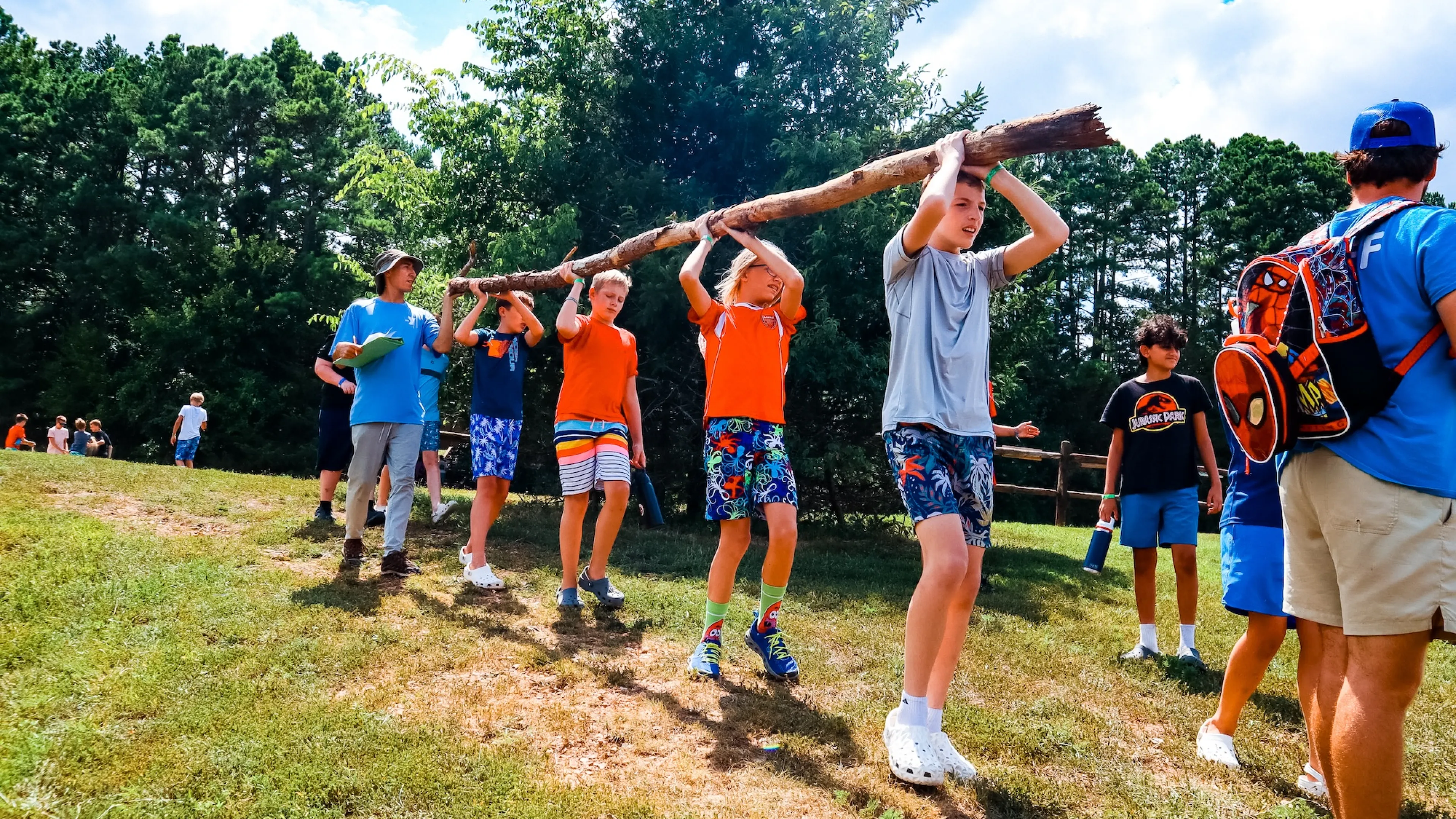 ymca camp lakewood 2025 campers carrying log