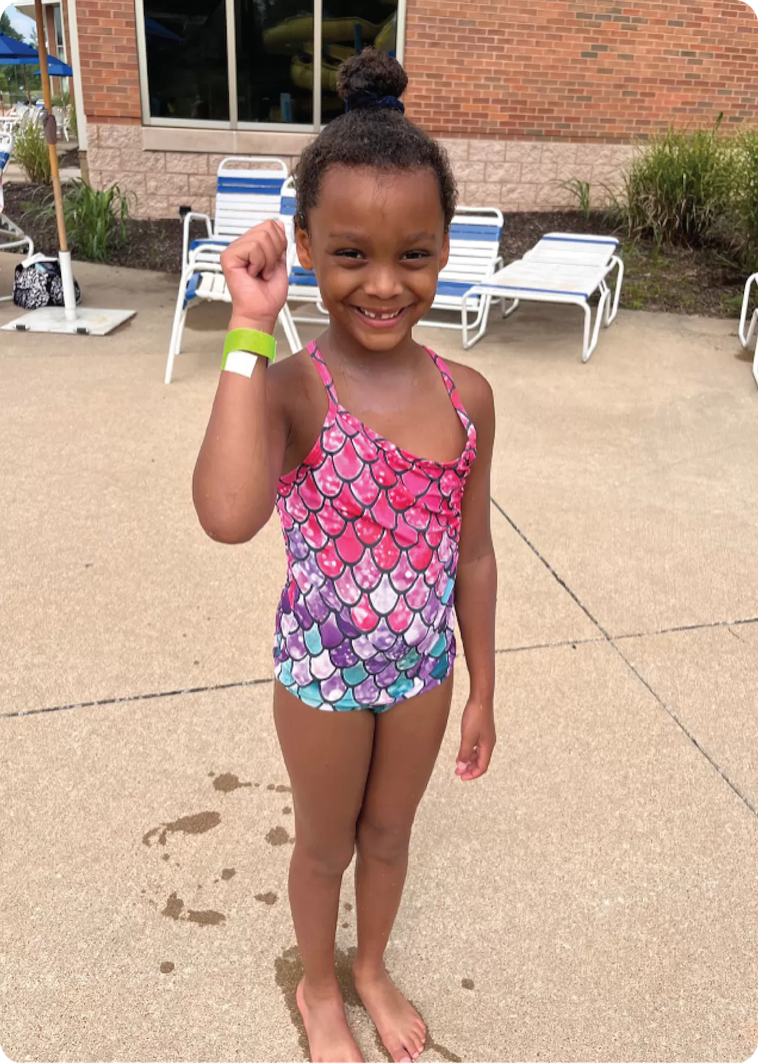 YMCA Go for Green Participant who Passed the Swim Test Receiving Their Green Band