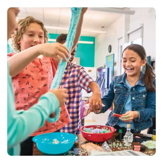 Children do a fun science experiment after school in Y Club before and after school care