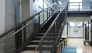 Thumbnail: Two-story teen technology center. Separate rooms for music production and STEM activities. Upstairs mezzanine area with seating and Esports computers.